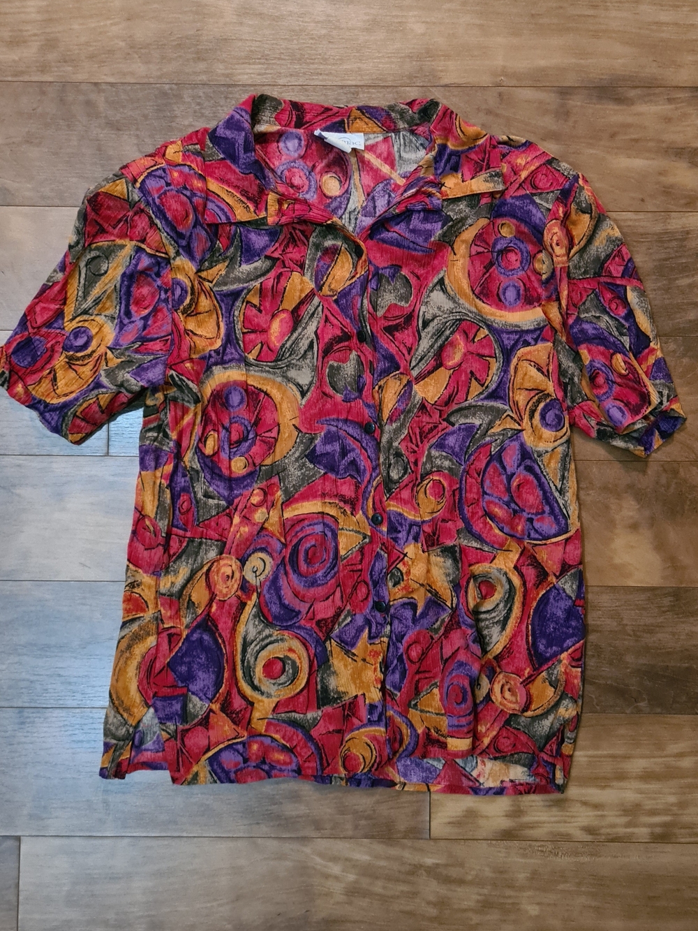 vintage short-sleeve button-down shirt w a colorful abstract geometric print